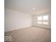 Spacious carpeted bedroom with large window and access to bathroom at 259 Lar Lan Dr, Danville, IN 46122