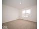 Well-lit bedroom featuring carpet and a large window at 259 Lar Lan Dr, Danville, IN 46122