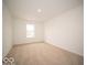 Well-lit bedroom with carpet and a window offering natural light at 259 Lar Lan Dr, Danville, IN 46122