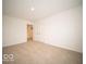 Spacious carpeted bedroom with double doors leading to hallway at 259 Lar Lan Dr, Danville, IN 46122