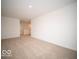 Spacious bedroom with carpet and access to a hallway and loft area at 259 Lar Lan Dr, Danville, IN 46122