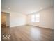 Open living space with hardwood floors and access to a bathroom at 259 Lar Lan Dr, Danville, IN 46122