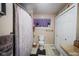 Clean bathroom with shower/tub combo, toilet and linen closet at 3136 E Edgewood Ave, Indianapolis, IN 46227