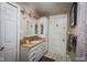 Updated bathroom with granite vanity and a separate shower at 3136 E Edgewood Ave, Indianapolis, IN 46227