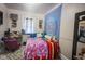 Cozy bedroom with a full bed, desk, and wall tapestry at 3136 E Edgewood Ave, Indianapolis, IN 46227