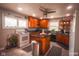 Bright kitchen with an island, wood cabinets, and stainless steel appliances at 3136 E Edgewood Ave, Indianapolis, IN 46227