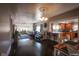 Open living space with dark hardwood floors and kitchen view at 3136 E Edgewood Ave, Indianapolis, IN 46227