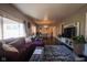 Spacious living room with hardwood floors and a sectional sofa at 3136 E Edgewood Ave, Indianapolis, IN 46227