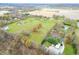 Aerial view of property, including a pond and surrounding homes at 5719 Hickory Rd, Indianapolis, IN 46239