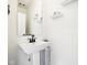 Small bathroom with pedestal sink and modern fixtures at 1014 Sterling St, Indianapolis, IN 46201