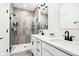 Contemporary bathroom featuring a walk-in shower with grey tile and double vanity at 1014 Sterling St, Indianapolis, IN 46201