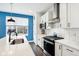 Modern kitchen with white cabinets, subway tile backsplash and stainless steel appliances at 1014 Sterling St, Indianapolis, IN 46201