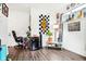 Home office with a desk, mini-fridge, and wall decor at 1014 Sterling St, Indianapolis, IN 46201