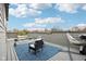 Relaxing rooftop deck features comfy seating, a hammock, and city views at 1014 Sterling St, Indianapolis, IN 46201