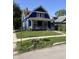 Blue house with gray accents and a red front door at 350 S Grand Ave, Indianapolis, IN 46219