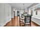 Elegant dining room with hardwood floors and modern chandelier at 5437 Winthrop Ave, Indianapolis, IN 46220