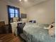 Bedroom featuring a full bed, dresser, and hardwood floors at 620 Valley Dr, Martinsville, IN 46151