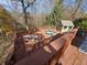 Large deck with wooden railings, furniture, and a shed at 620 Valley Dr, Martinsville, IN 46151