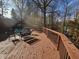 Spacious deck with seating area and wooded backdrop at 620 Valley Dr, Martinsville, IN 46151