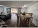 Dining area with farmhouse table and access to a sunroom at 620 Valley Dr, Martinsville, IN 46151