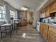 Eat-in kitchen with oak cabinets and vinyl flooring at 620 Valley Dr, Martinsville, IN 46151