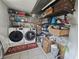 Well-organized laundry room with washer, dryer, and ample shelving at 620 Valley Dr, Martinsville, IN 46151