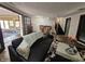 Living room with fireplace, sunroom access, and a cowhide rug at 620 Valley Dr, Martinsville, IN 46151