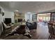 Open living area with a fireplace, sunroom access, and a cowhide rug at 620 Valley Dr, Martinsville, IN 46151