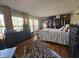 Main bedroom with hardwood floors, large windows, and walk-in closet at 620 Valley Dr, Martinsville, IN 46151