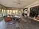 Spacious sunroom with seating area, fireplace, and deck access at 620 Valley Dr, Martinsville, IN 46151