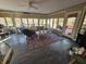 Sunroom features a comfortable seating area and access to a deck at 620 Valley Dr, Martinsville, IN 46151