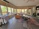 Sunroom offers a relaxing space with comfortable furniture and deck views at 620 Valley Dr, Martinsville, IN 46151