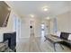 Bright living room with hardwood floors and views into adjacent bathroom and bedroom at 7102 Beal Ln, Indianapolis, IN 46217