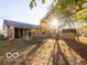 Sunlit backyard with shed and screened porch at 304 Chestnut St, Danville, IN 46122