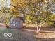 Wooden shed nestled amongst autumn trees at 304 Chestnut St, Danville, IN 46122