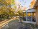Screened porch and surrounding trees in fall at 304 Chestnut St, Danville, IN 46122