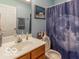 Clean bathroom with a shower/tub combo and updated vanity at 304 Chestnut St, Danville, IN 46122