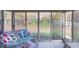 Sunroom with view of backyard and comfortable seating at 304 Chestnut St, Danville, IN 46122