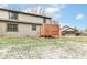 Spacious backyard with a wooden deck and partial snow cover at 8191 Frisco Way, Indianapolis, IN 46240