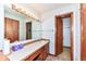Clean bathroom with vanity, mirror, and linen closet at 8191 Frisco Way, Indianapolis, IN 46240