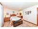 Bedroom with a queen bed, dresser and wall decor at 8191 Frisco Way, Indianapolis, IN 46240
