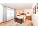 Bedroom with wood bed frame and access to the bathroom at 8191 Frisco Way, Indianapolis, IN 46240