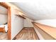 Walk-in attic closet with wooden shelving at 8191 Frisco Way, Indianapolis, IN 46240