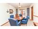 Charming dining room with a round table and blue chairs at 8191 Frisco Way, Indianapolis, IN 46240