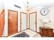 Bright entryway with tiled floor, coat closet, and wood door at 8191 Frisco Way, Indianapolis, IN 46240