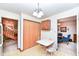 Kitchen features wood cabinets, a small table, and access to other rooms at 8191 Frisco Way, Indianapolis, IN 46240