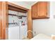 Laundry area with washer, dryer, and shelving at 8191 Frisco Way, Indianapolis, IN 46240