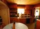 Retro kitchen with wood cabinets and a round dining table at 821 N Tuxedo St, Indianapolis, IN 46201