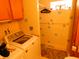 Small laundry room with washer, dryer, and shower at 821 N Tuxedo St, Indianapolis, IN 46201