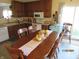 Dining room with a wooden table and chairs, adjacent to the kitchen at , Greenwood, IN 46143
